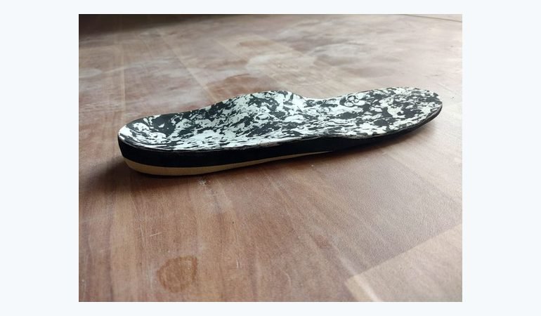Custom moulded insole shown in side profile, made at Limbgenixx