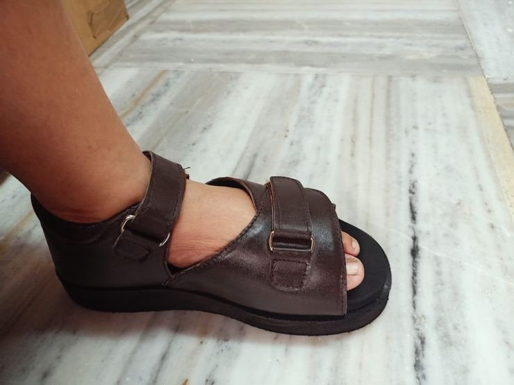 Orthopaedic sandal worn, side profile showing strap position