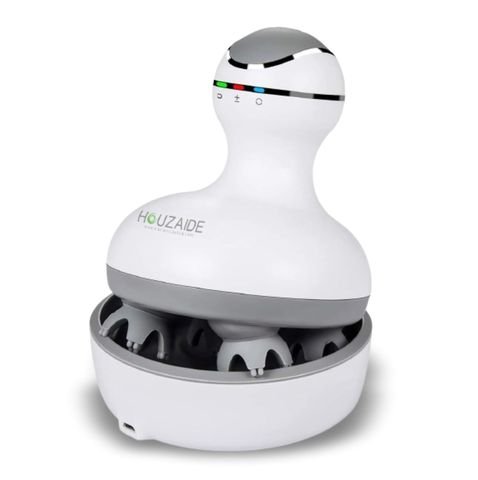 HOUZAIDE head massager in a gourd shape with three coloured indicator lights, resting in its round storage base