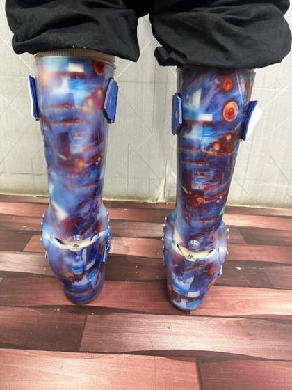 Custom AFO pair worn by a patient, rear view showing calf shells