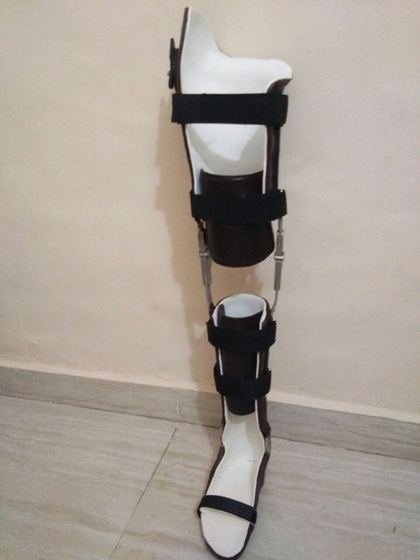 Full length KAFO with knee joint and leather cuffs, made at Limbgenixx