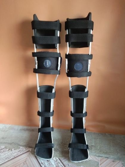 Pair of KAFOs with metal uprights and padded cuffs