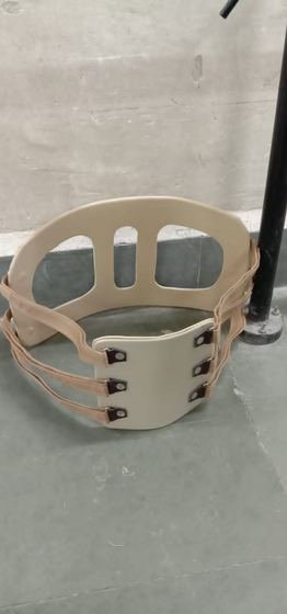 Moulded lumbosacral orthosis with adjustable strapping