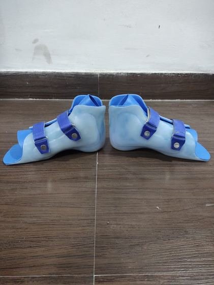 Paediatric AFO pair in blue, side profile showing footplate