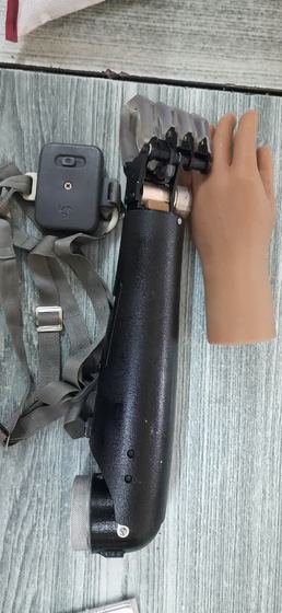 Body-powered prosthetic arm with harness, cosmetic hand and hook terminal device