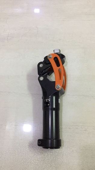 Pneumatic prosthetic knee joint with extension assist spring