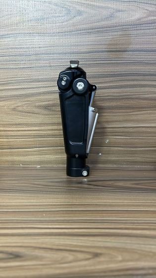Prosthetic knee joint with integrated pylon and clamp